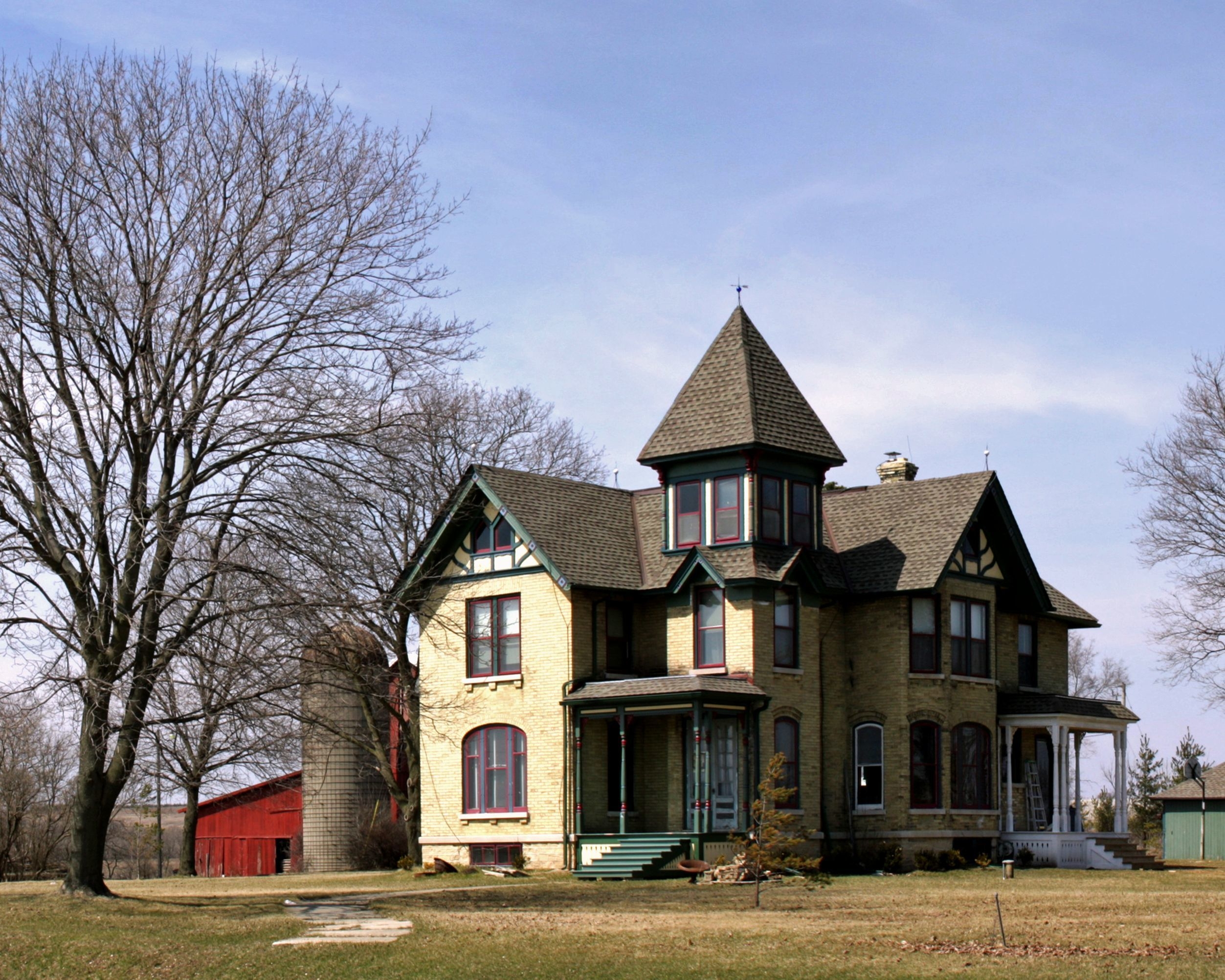 Beautiful shot of a big farmhouse in a clear blue sky