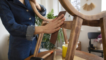 side-view-woman-restoring-wooden-furniture